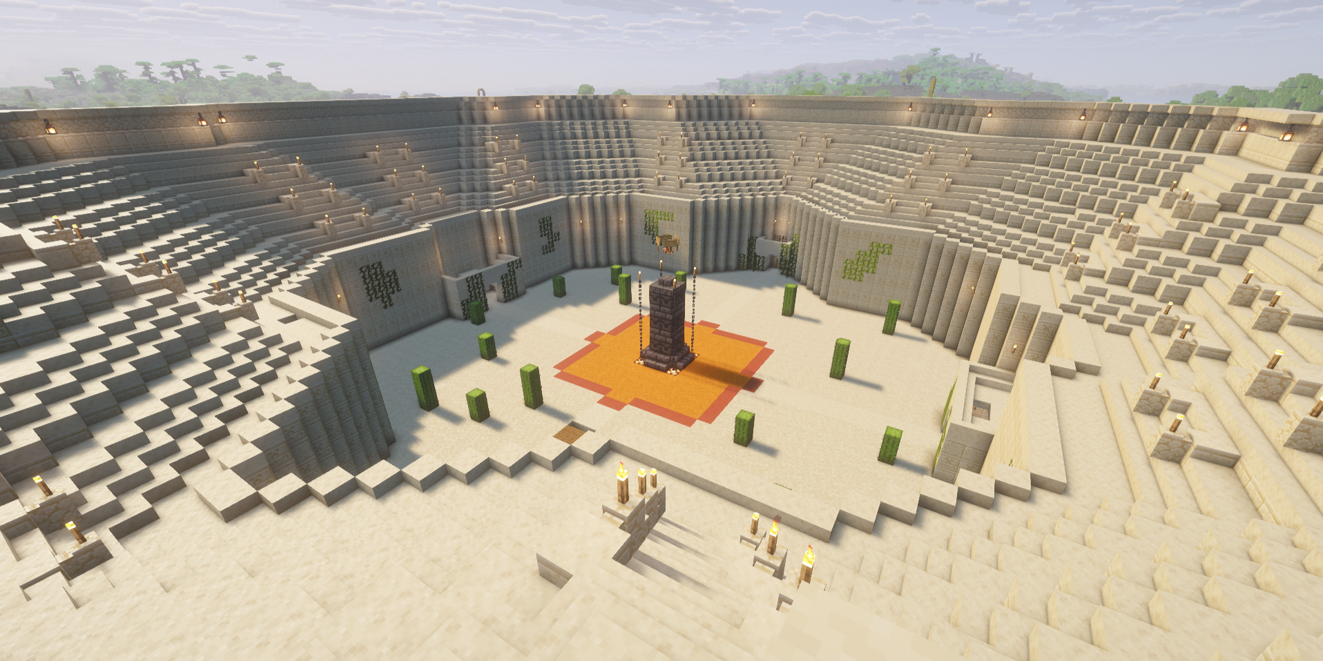 Inside of sandy colloseum arena with seating.